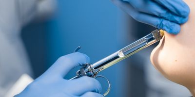 A doctor uses local anesthesia to reduce the pain.