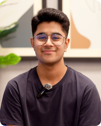 A paitient sitting in front of the camera after getting the dental service.