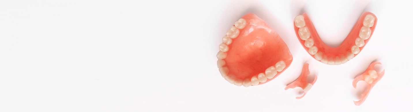 Partial dentures and complete dentures are shown.